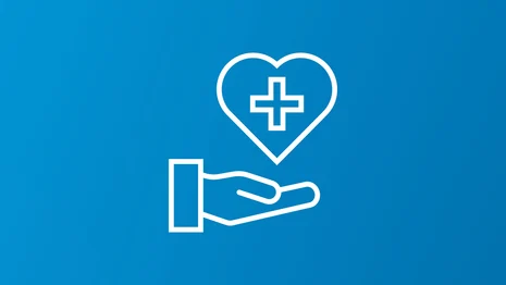 Symbolische Darstellung einer Hand über der ein Herz mit medizinischem Kreuz schwebt